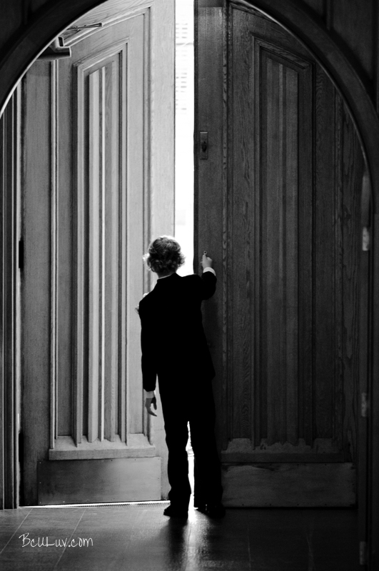 A wedding usher looks for the bride